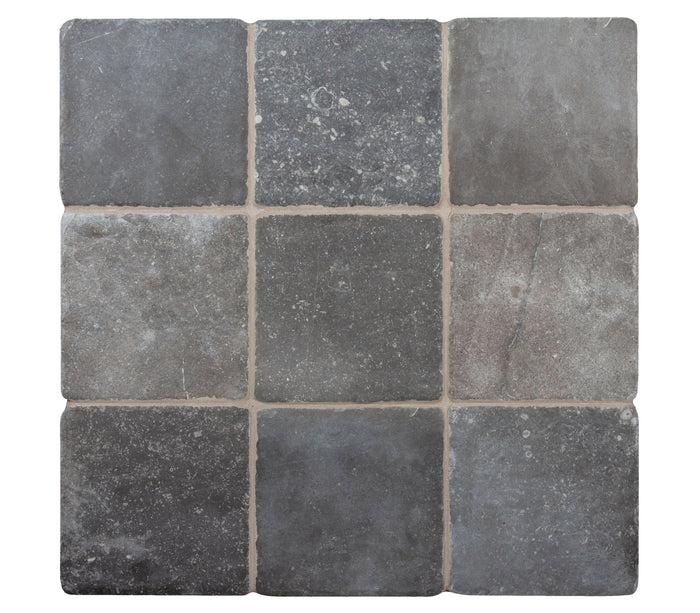 A board of nine Italian Porcelain 8x8 tiles in Nero, dark with subtle white and brown veining, seen from above