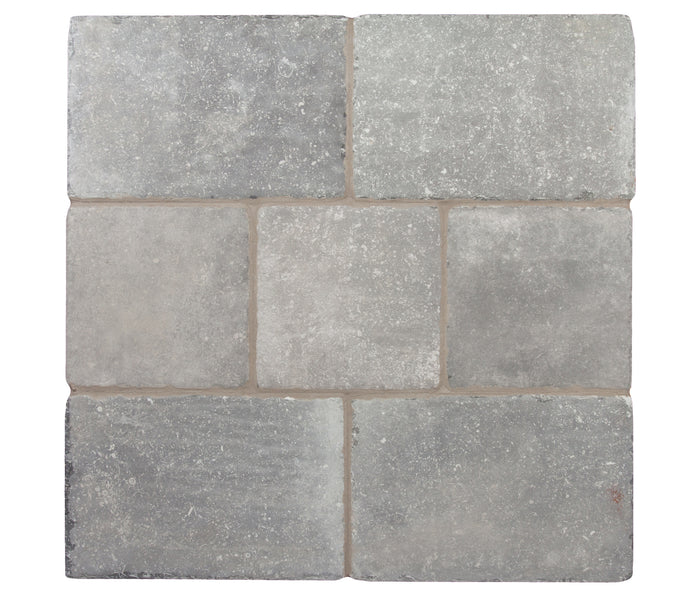 A board of Italian Porcelain tiles in Grigio, mixed sizes laid together, a versatile stone grey, seen from above
