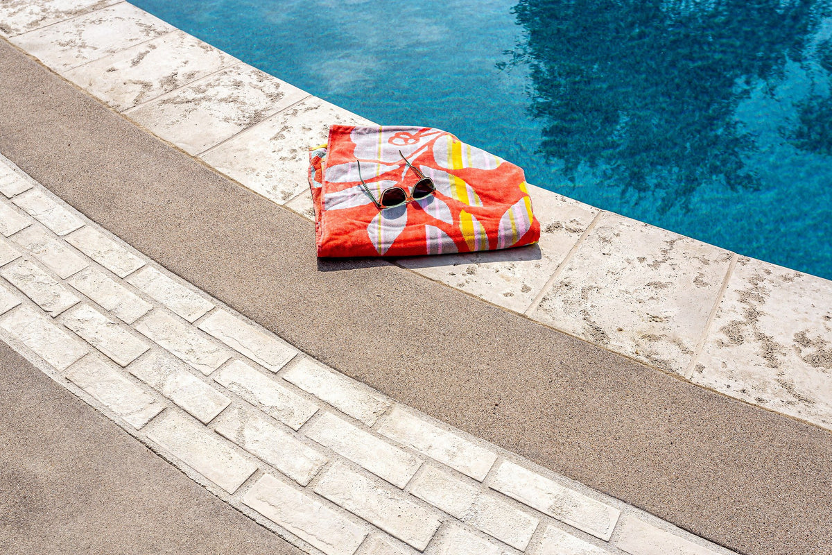 Thin brick banding at pool edge