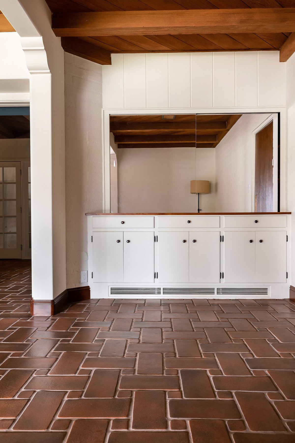 Built-in cabinets above the tile floor