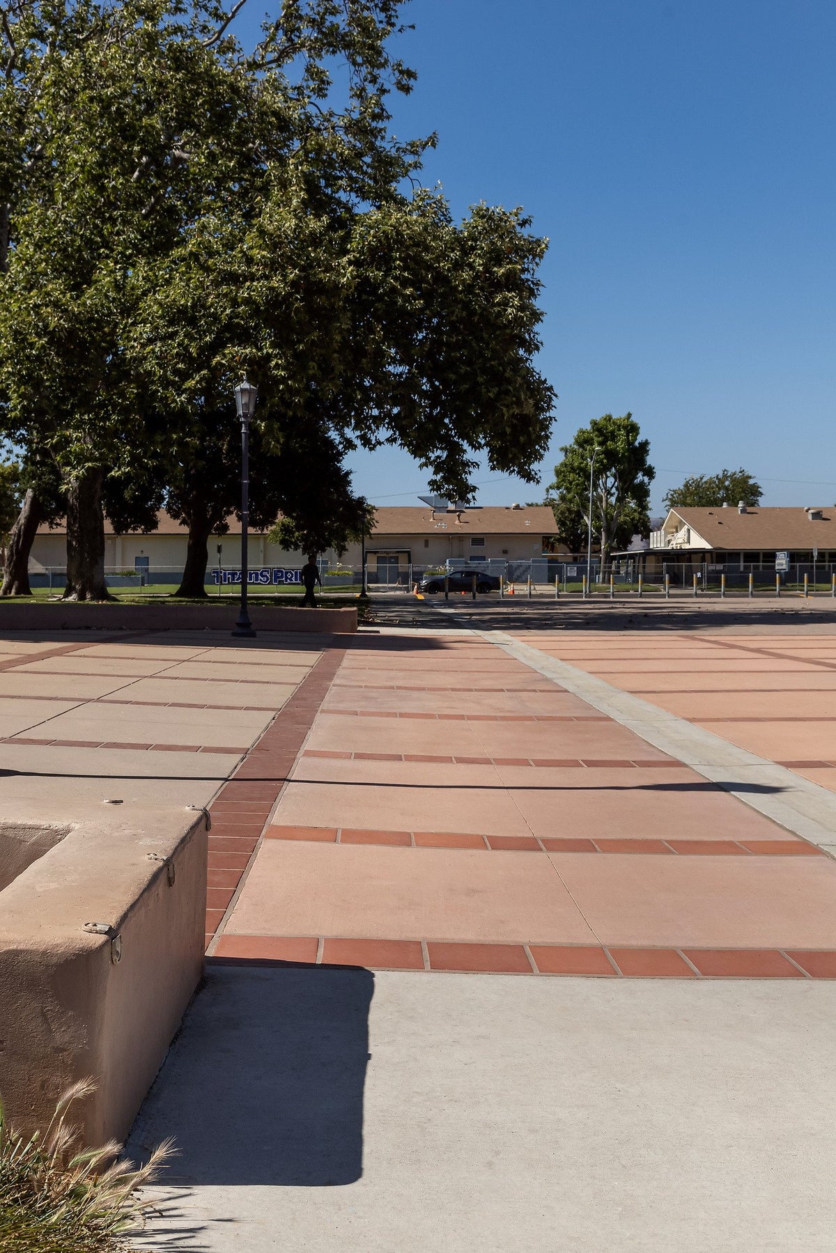 Tile bands running along the walk