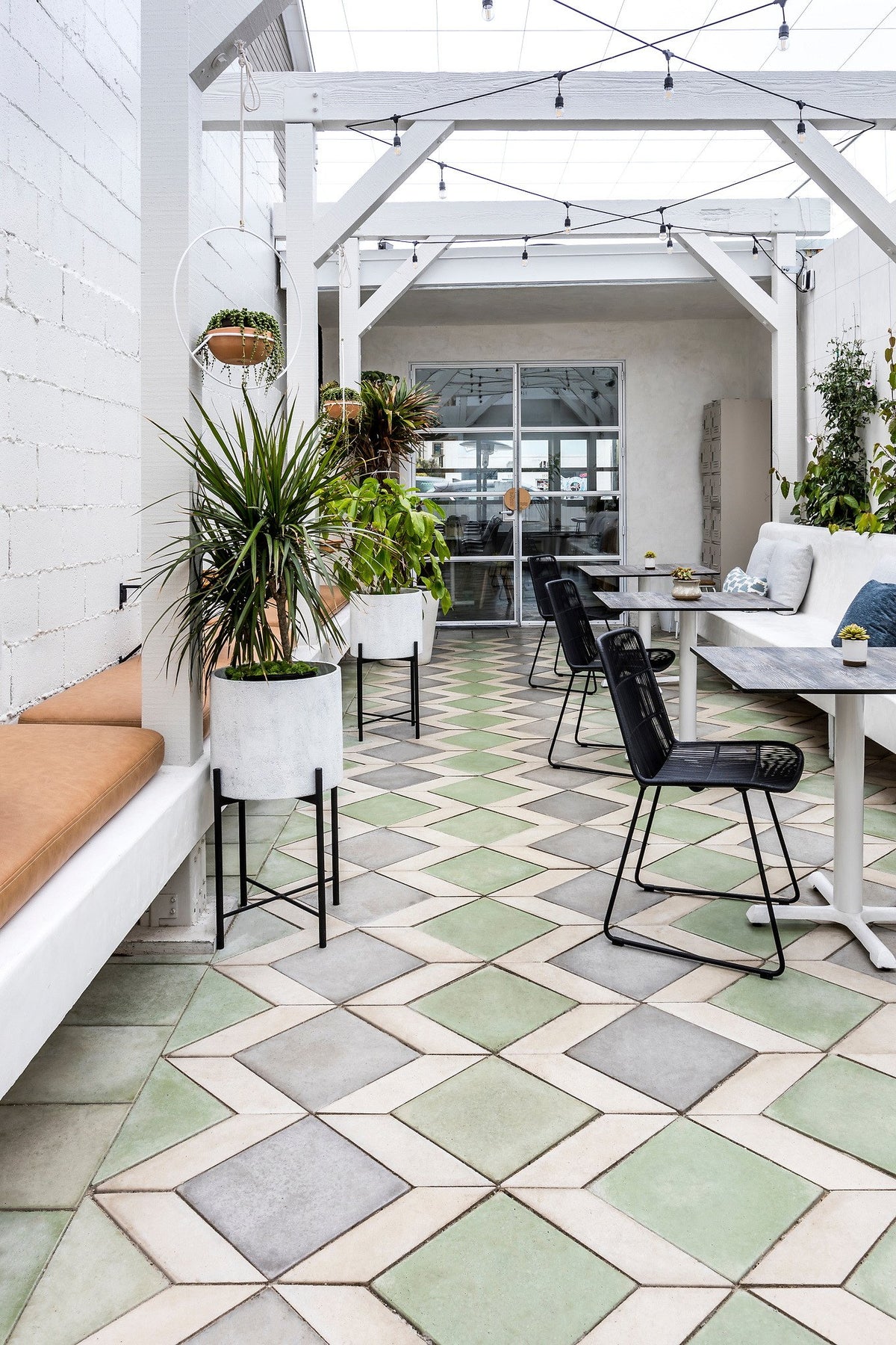 Planters along the tiled floor