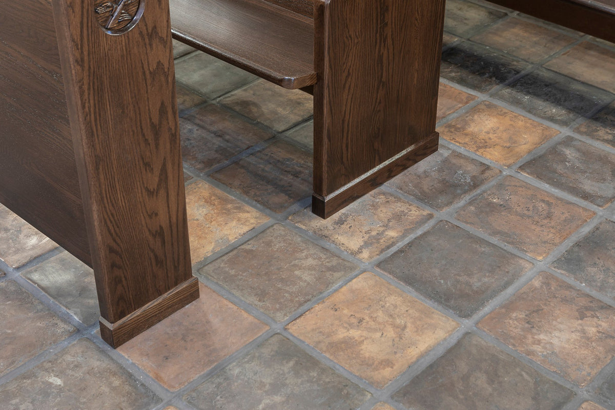Pew end on the tile floor