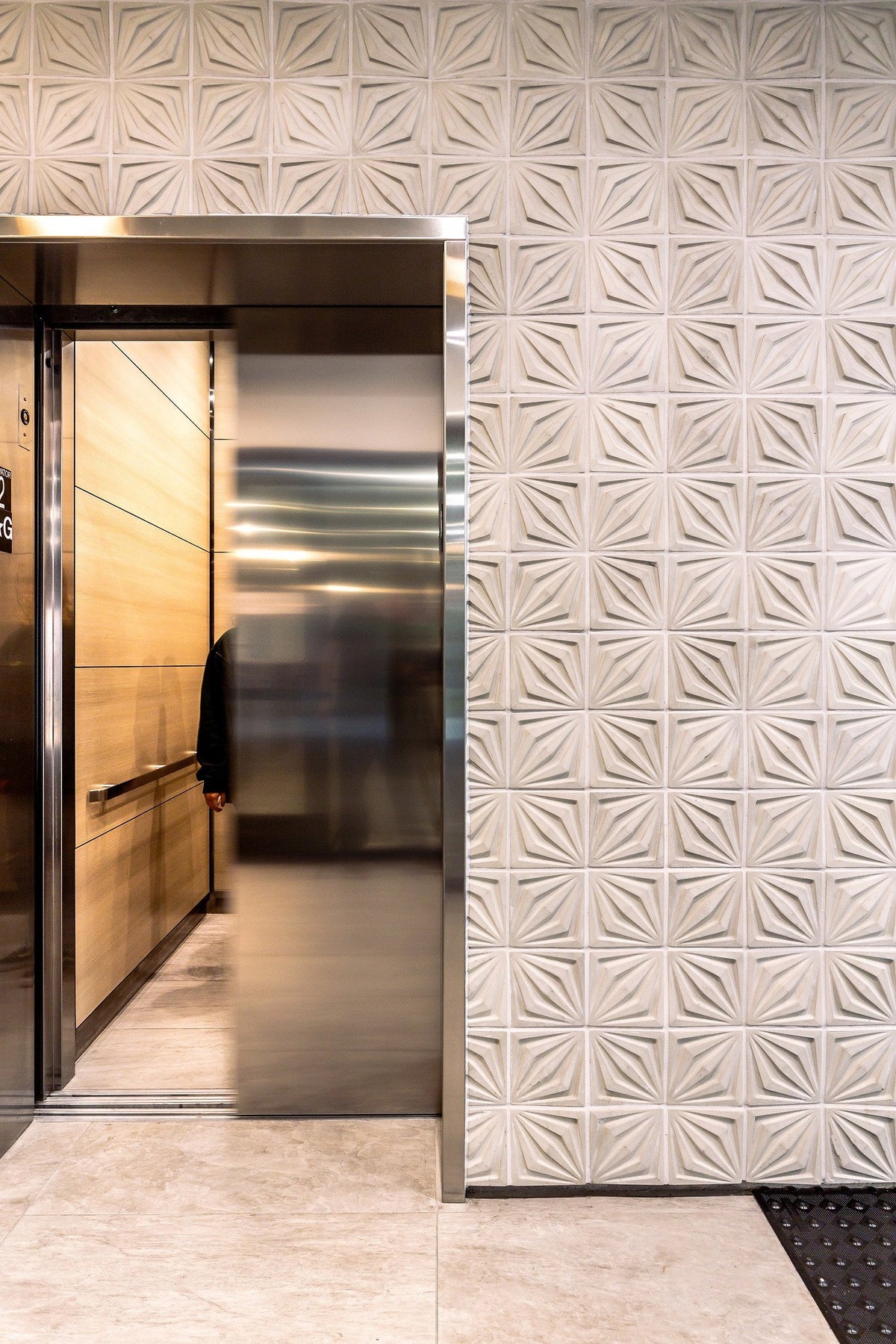 Compass tile at the elevator