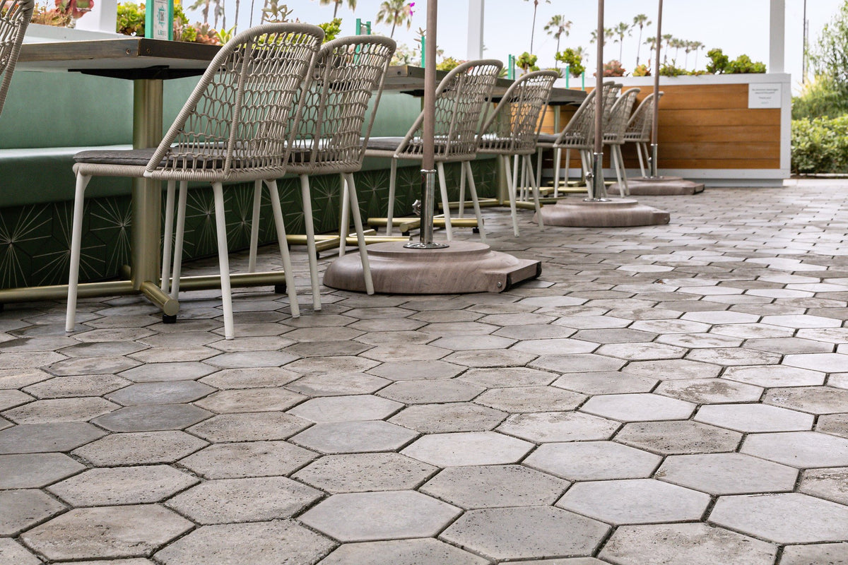 Dining chairs on gray hex pavers