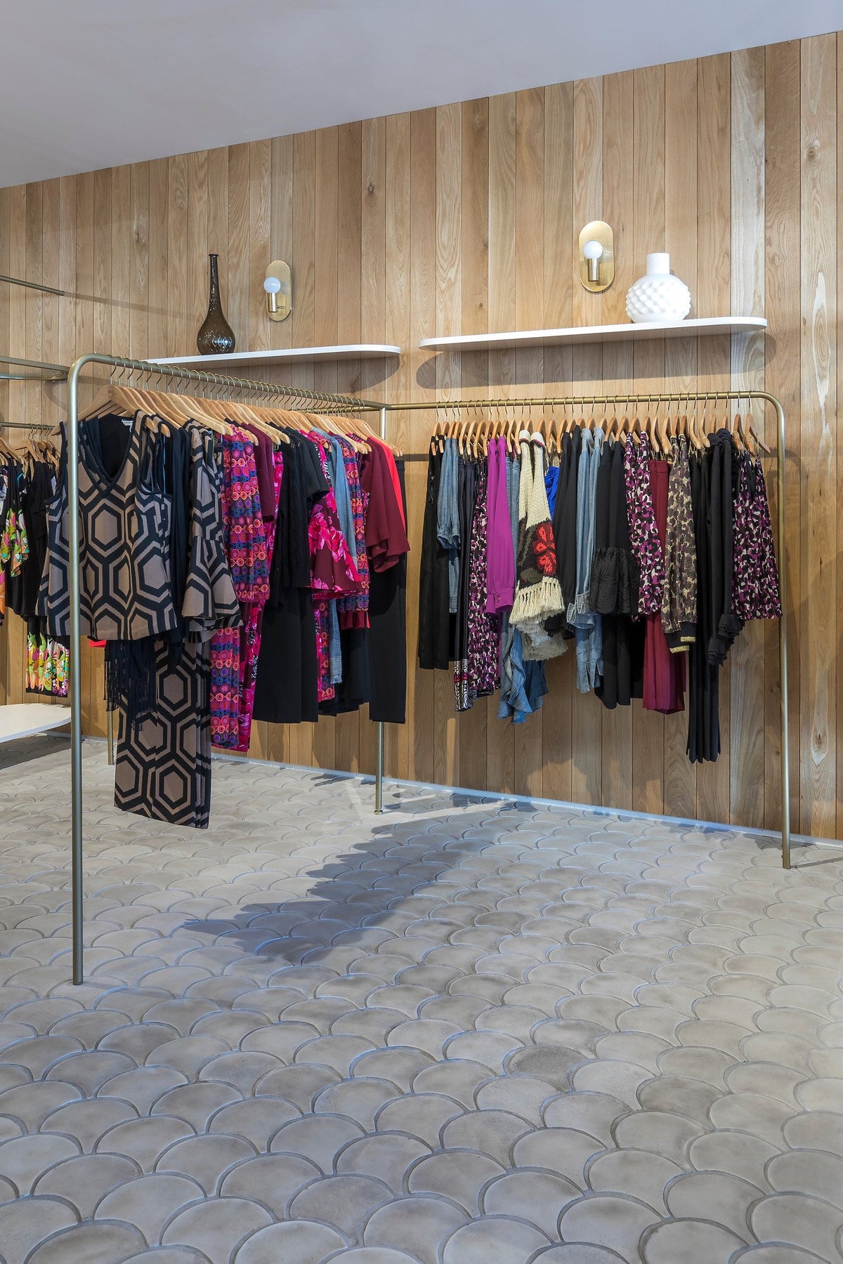Clothing racks over scalloped floor