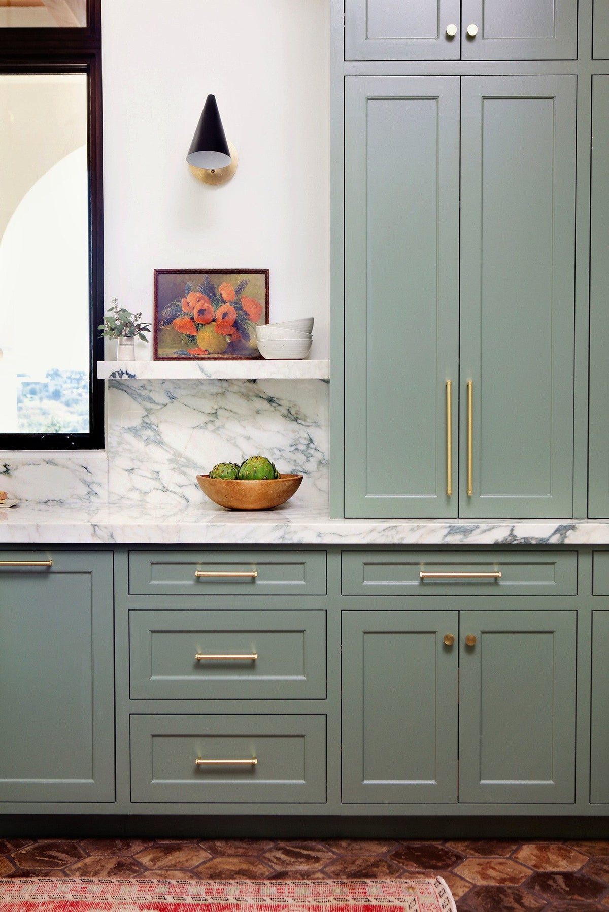 Cabinet wall above the tile floor