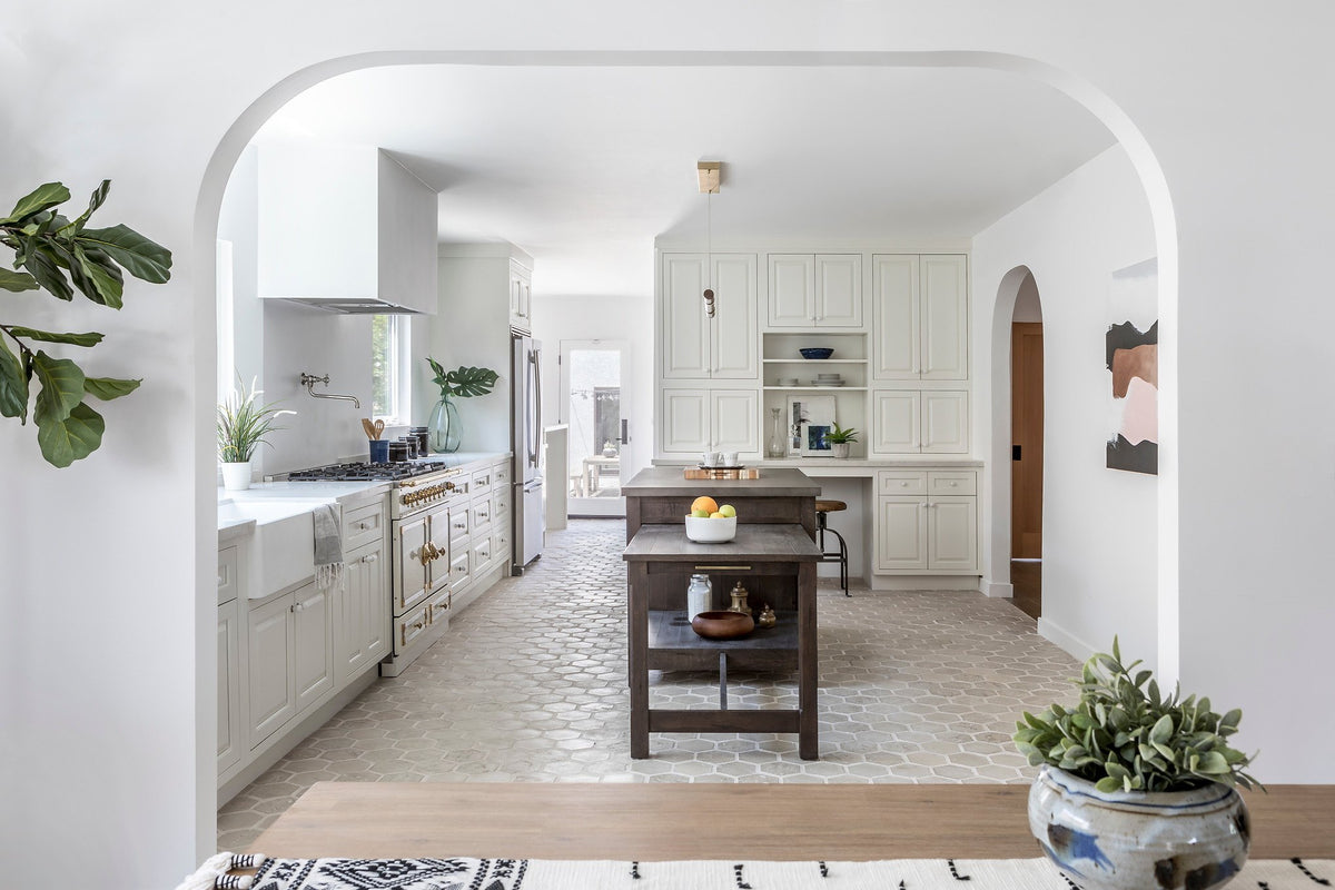 Kitchen through an arched opening