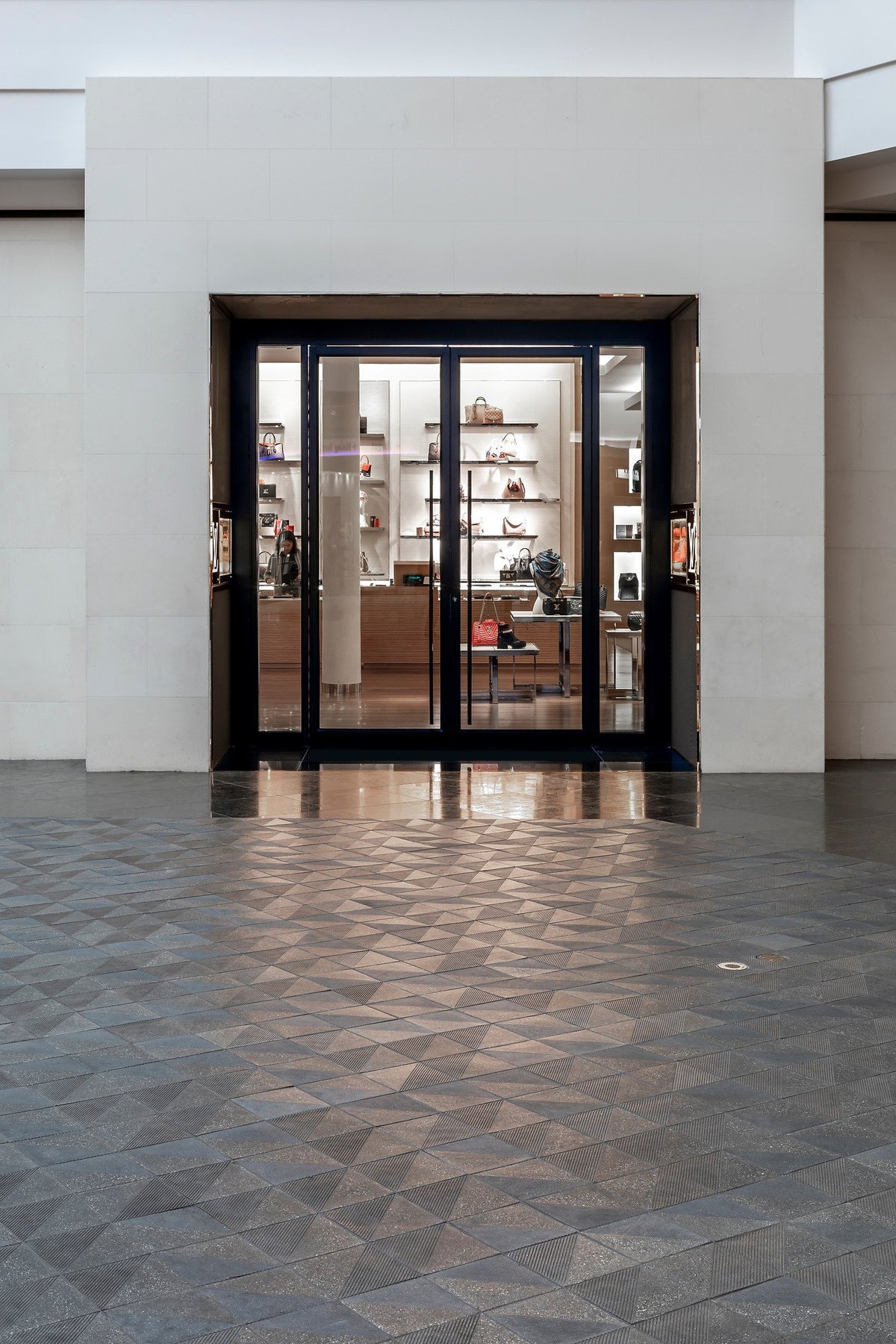 Storefront entry over triangle pattern
