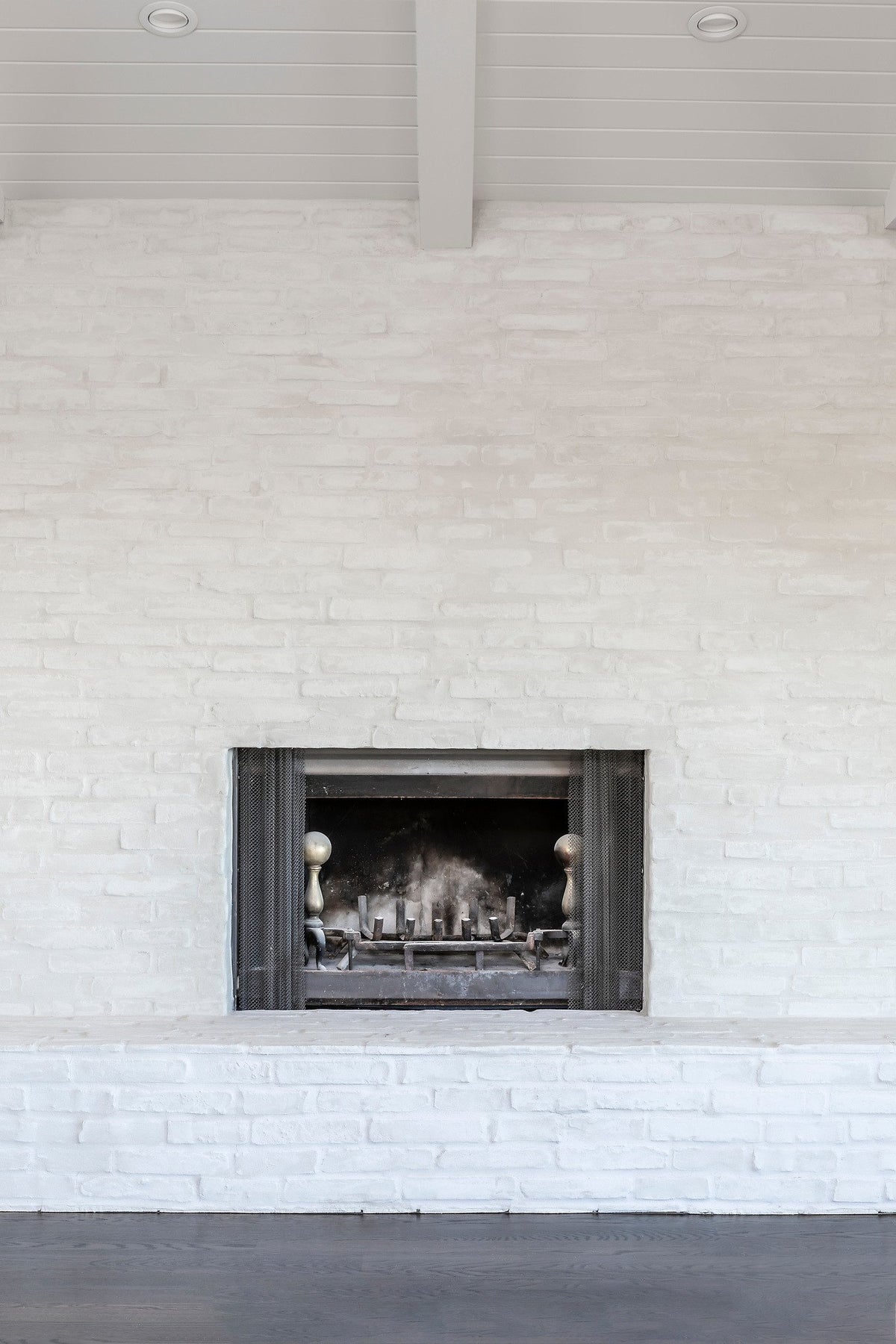 Brick chimney rising to the beams