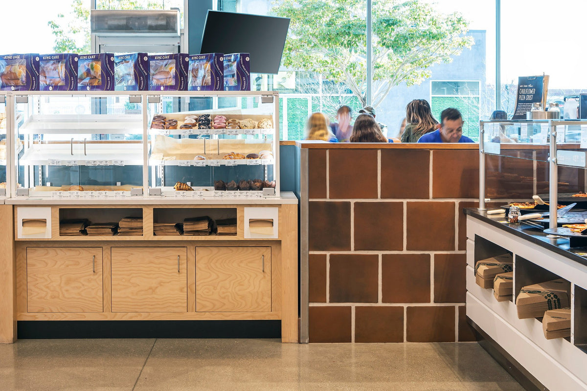 Tiled half wall by the seating